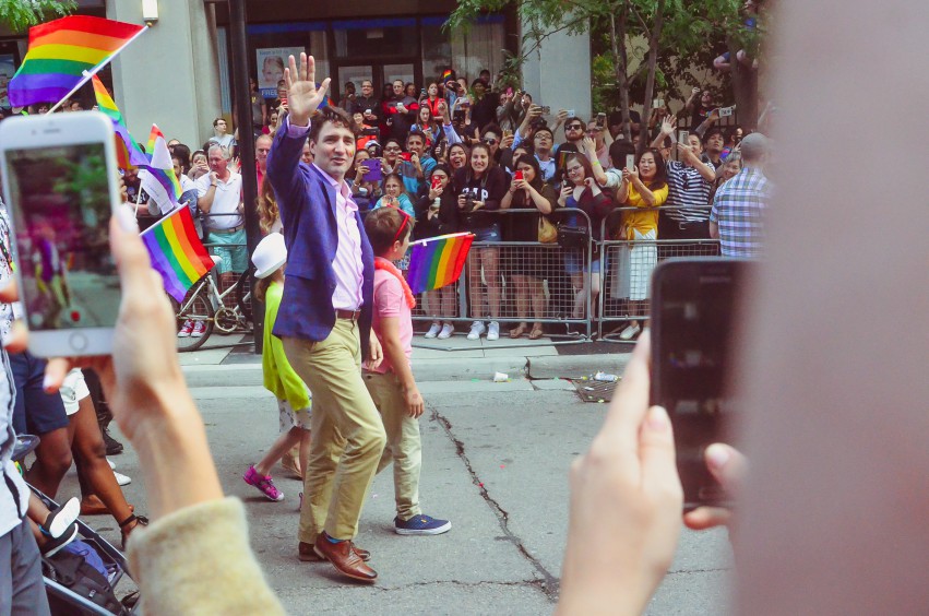 Photo of Canadian Prime Minister Justin Trudeau waving at Pride Parade by Joy Real from Unsplash